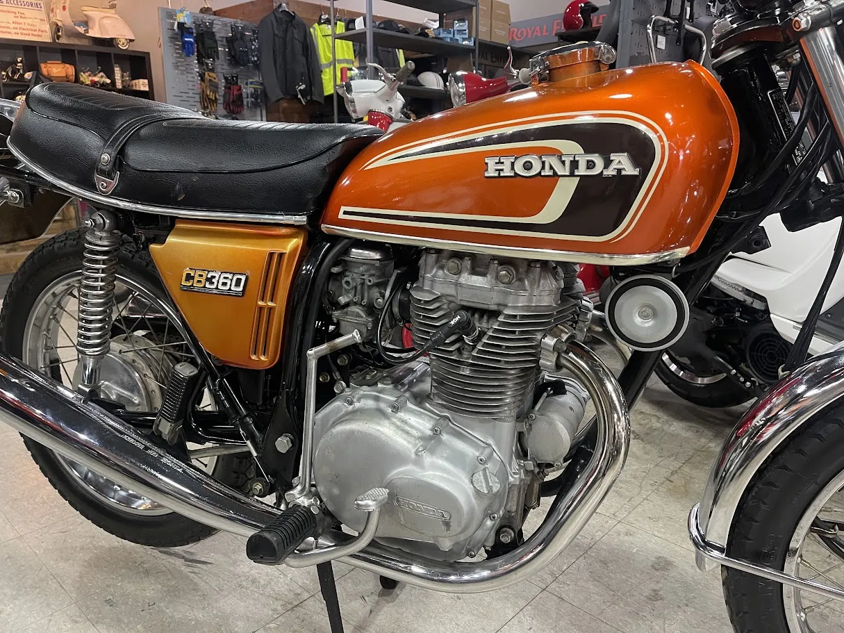 Used 1974 Honda CB360 in stock color, side profile, at The Motorcycle Shop San Antonio