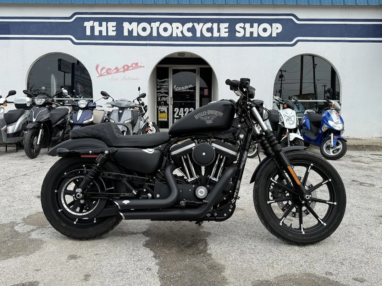 Used 2016 Harley-Davidson 883 Sportster “Iron Edition” in stock color, side profile, at The Motorcycle Shop San Antonio