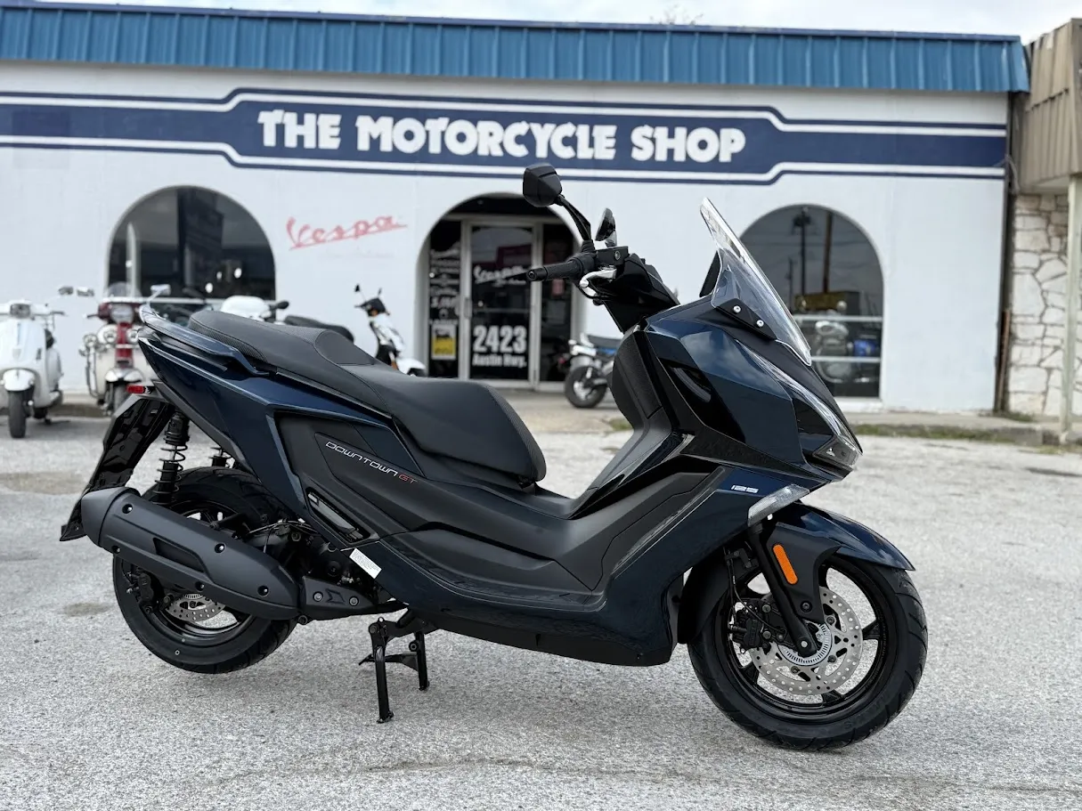 New 2026 Kymco Downtown 125i in stock color, side profile, at The Motorcycle Shop San Antonio